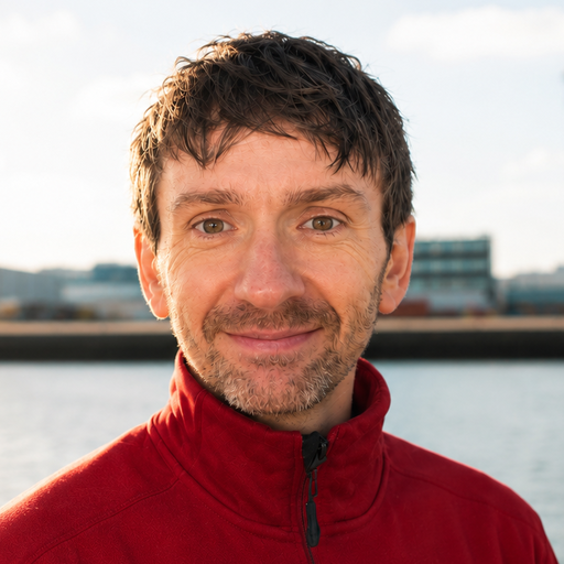 Outdoor portrait of Dan Brooke by the waterfront